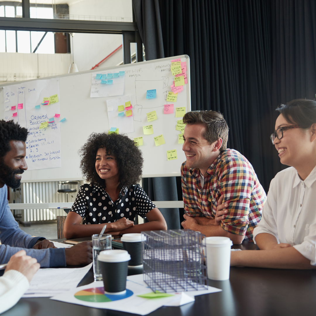 Image of a diverse team working together around a table